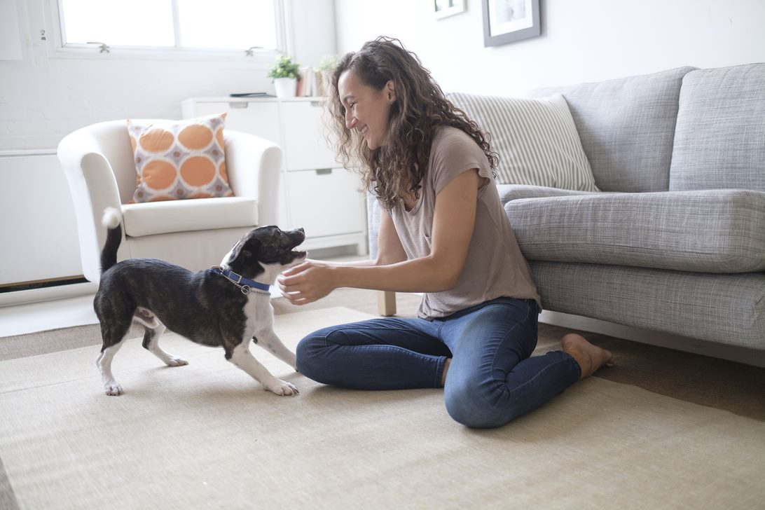 Lady playing with her dog